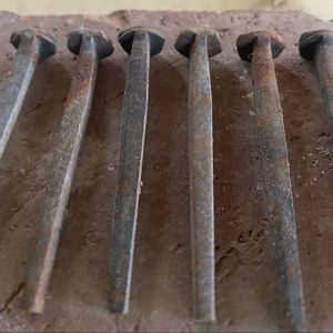Historic wrought iron hand forged nails square